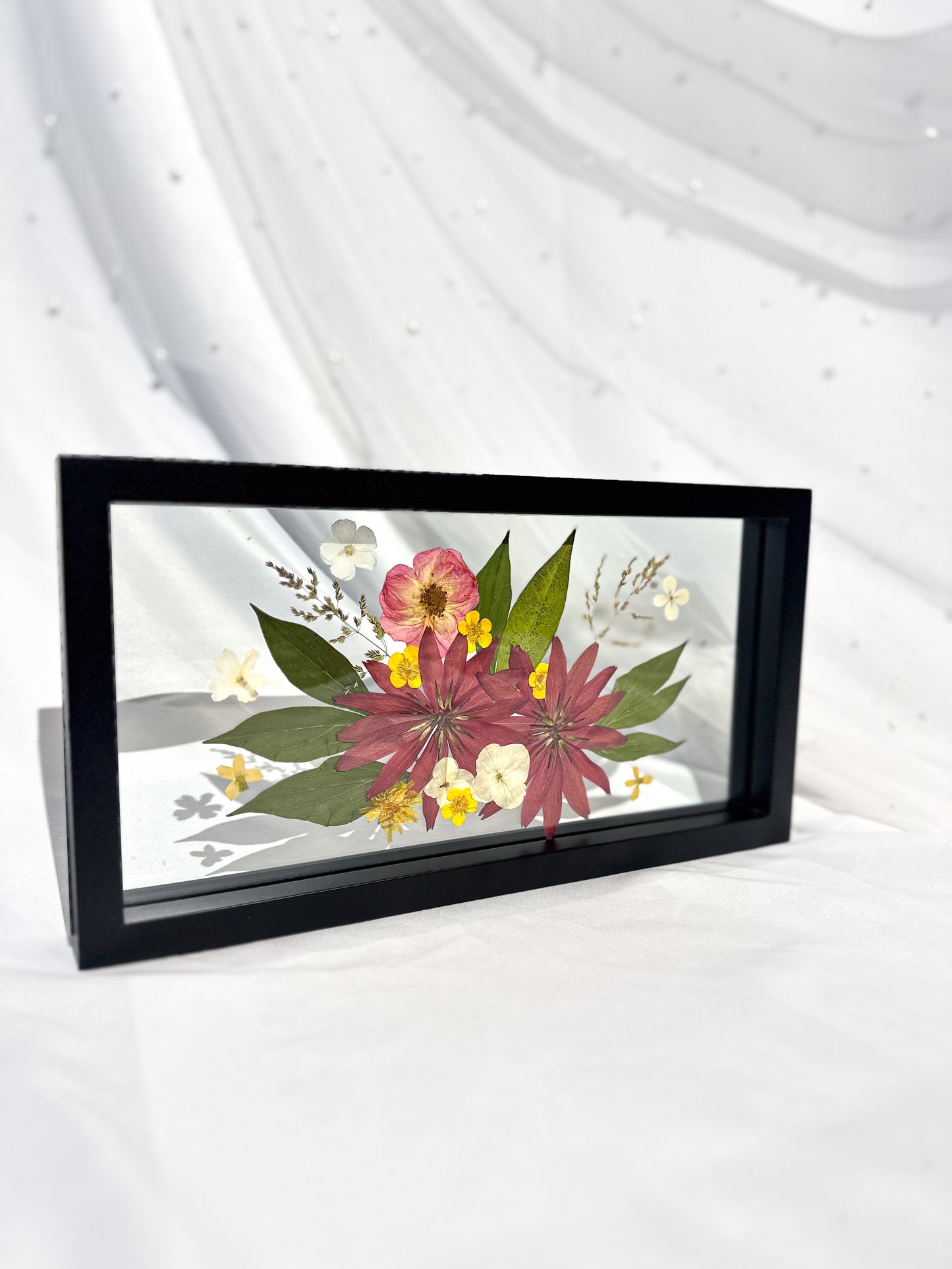 pressed flowers in frame